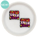 XOXO w/Flowers Glitter Silicone Focal Bead 27x31mm (Package of 2)