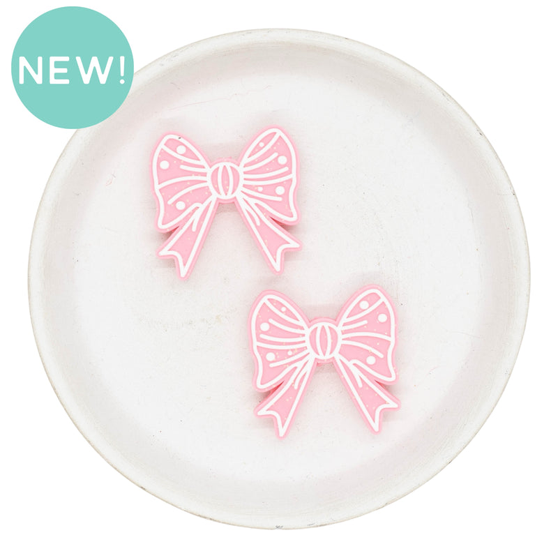 White Outlined Pink Bow Glitter Silicone Focal Bead 32mm (Package of 2)